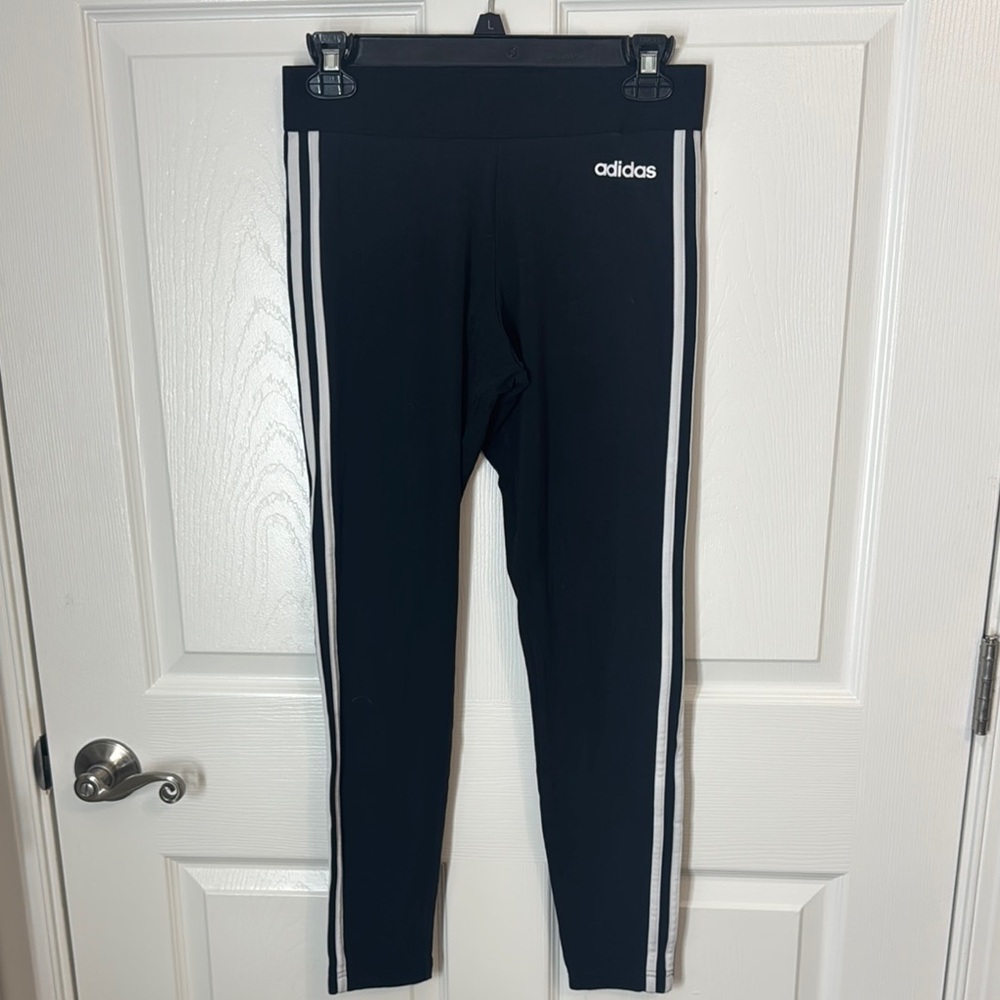 Adidas leggings with iconic stripe